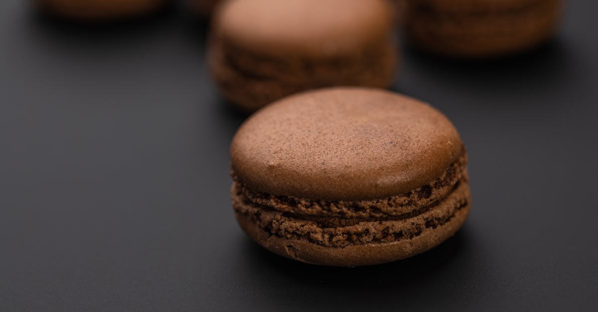 Forgot to put brown and white sugar in cookie dough - Chocolate sweet tasty macaroons on black background