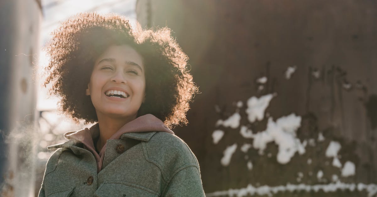 Freeze Soup very quickly Without Destroying the Content In Fridge? - Cheerful ethnic woman laughing on snowy winter street