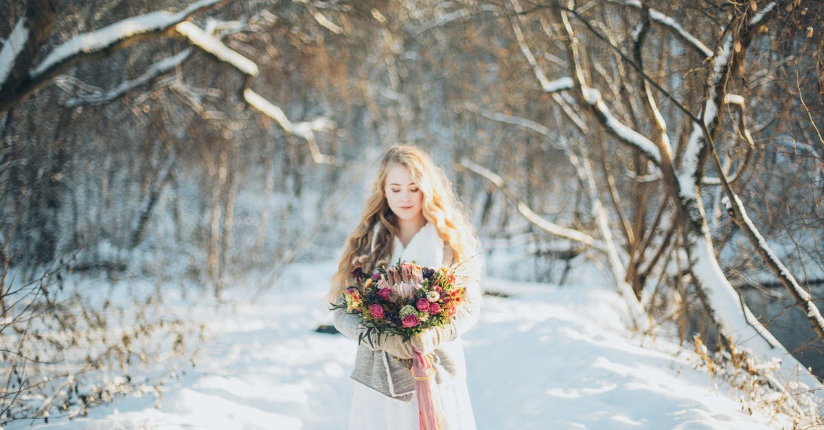 Freezing Buttercream Flowers for later use? - Woman Holding Flowers