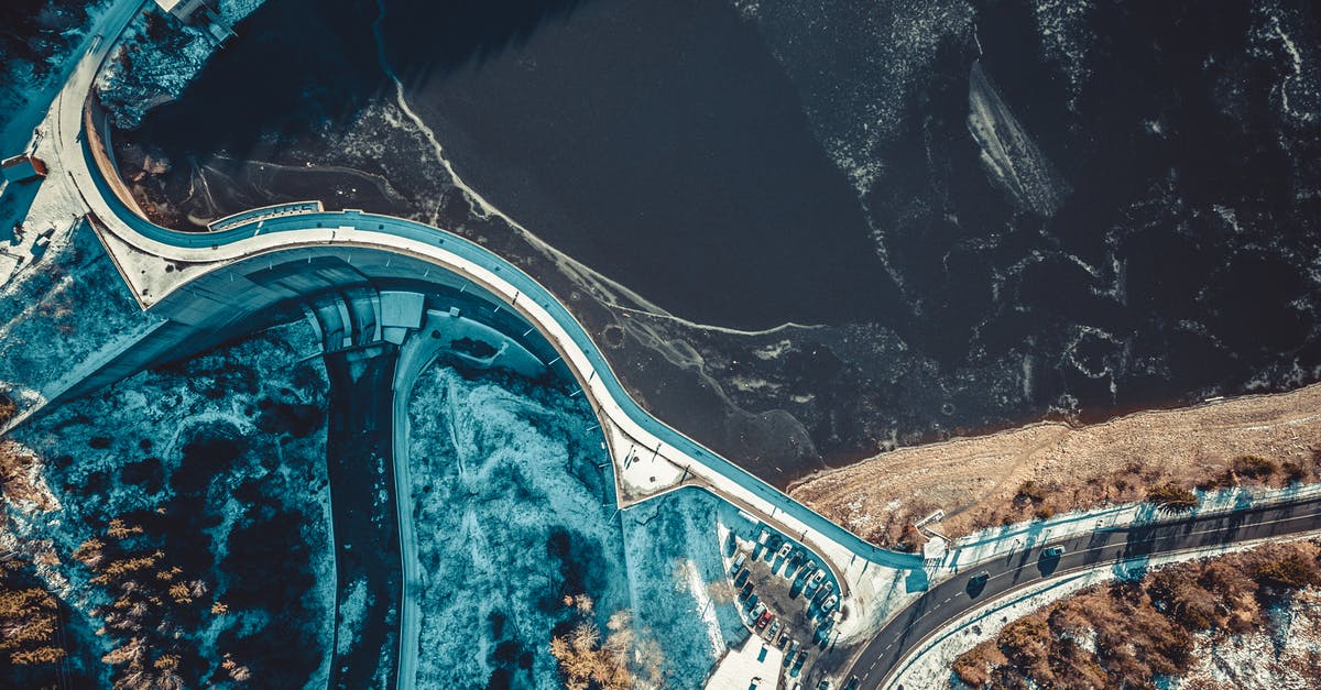 Freezing Soup Made Partly from Tins - Top-view Photography of Road Near the Body of Water