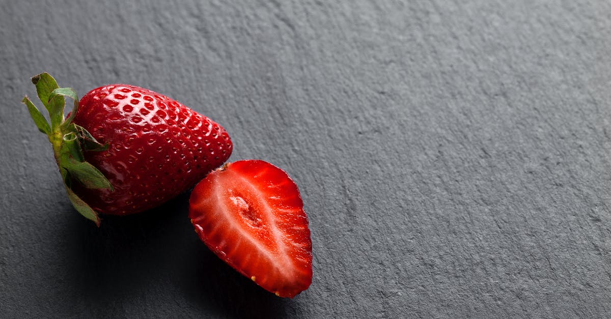 Freezing whole strawberries - Fresh Strawberries on Grey Background