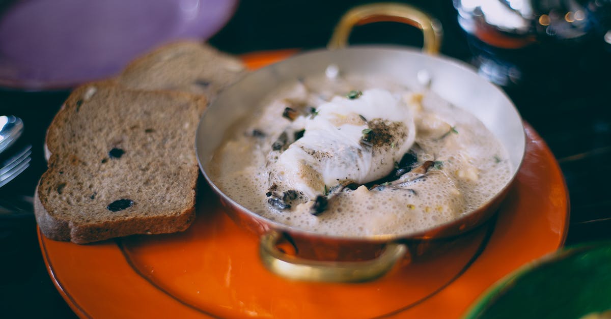 Fried gnocchi with spinach, bacon, cream sauce in a single pan - Delicious seafood served in pan