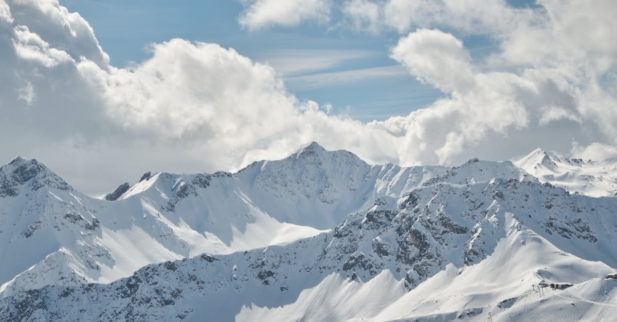 Frozen scallops - Snow Covered Mountain Under White Clouds and Blue Sky