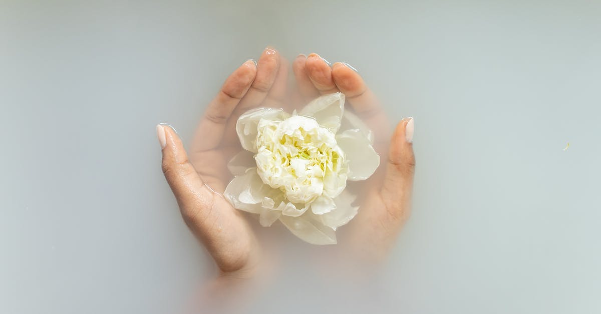 Fully submerged water bath for stove top baking? - Woman holding gentle ivory flower in hands