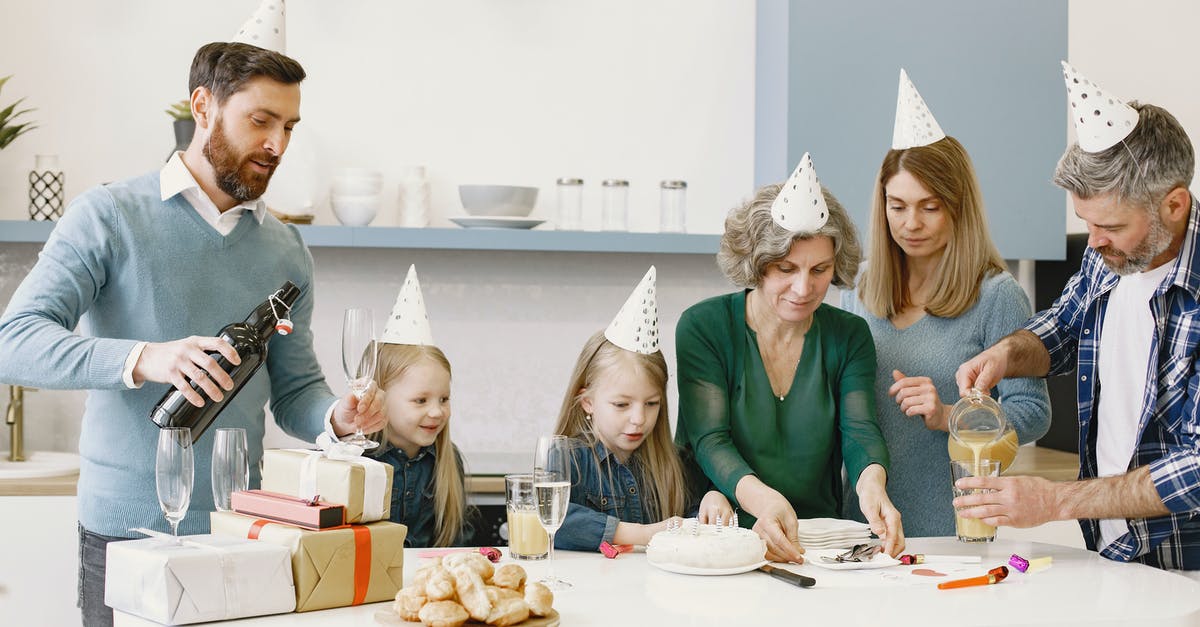 Ganache by pouring before fondanting a cake - People Preparing To Eat on A Party