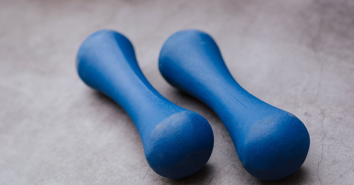 Ganache coating on a roulade - Modern similar blue dumbbells on gray background