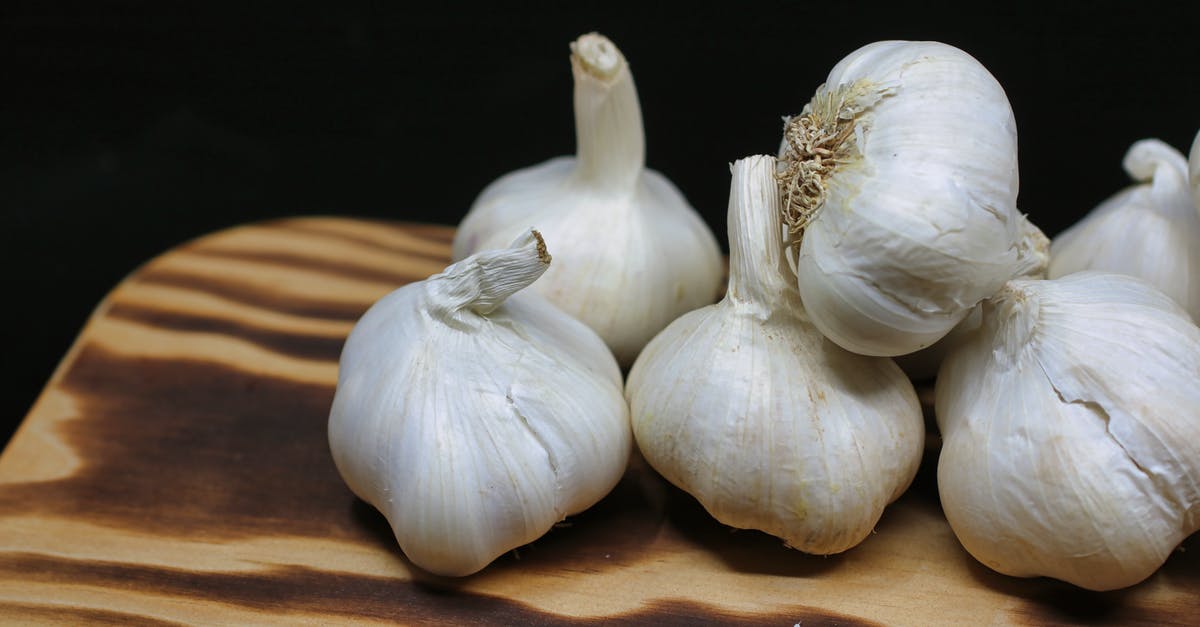 Garlic Cloves Size Differentiation - Garlic Bulbs on Brown Surface