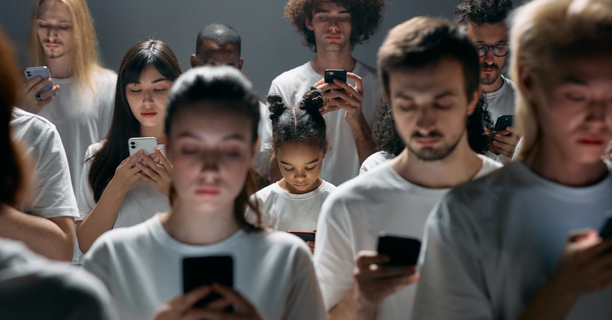 Gaul Divided into 3 fats - Photo of People Engaged on their Phones