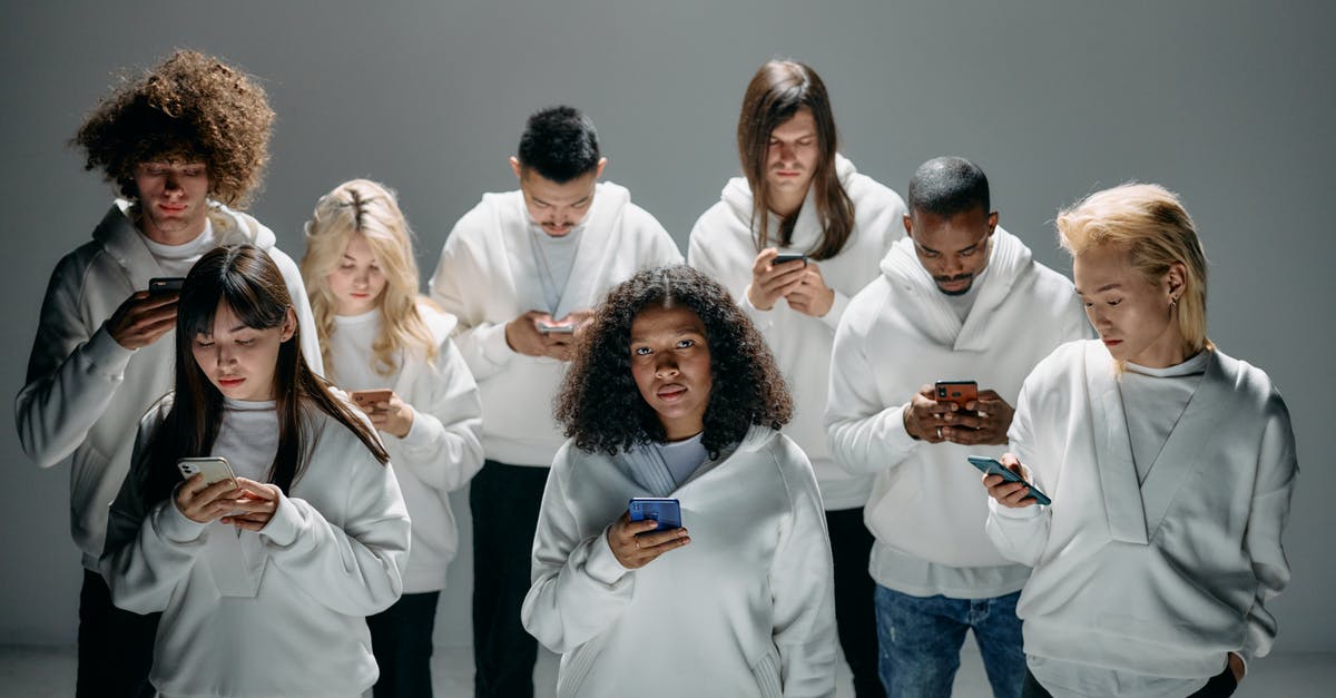 Gaul Divided into 3 fats - Photo of People Engaged on their Phones