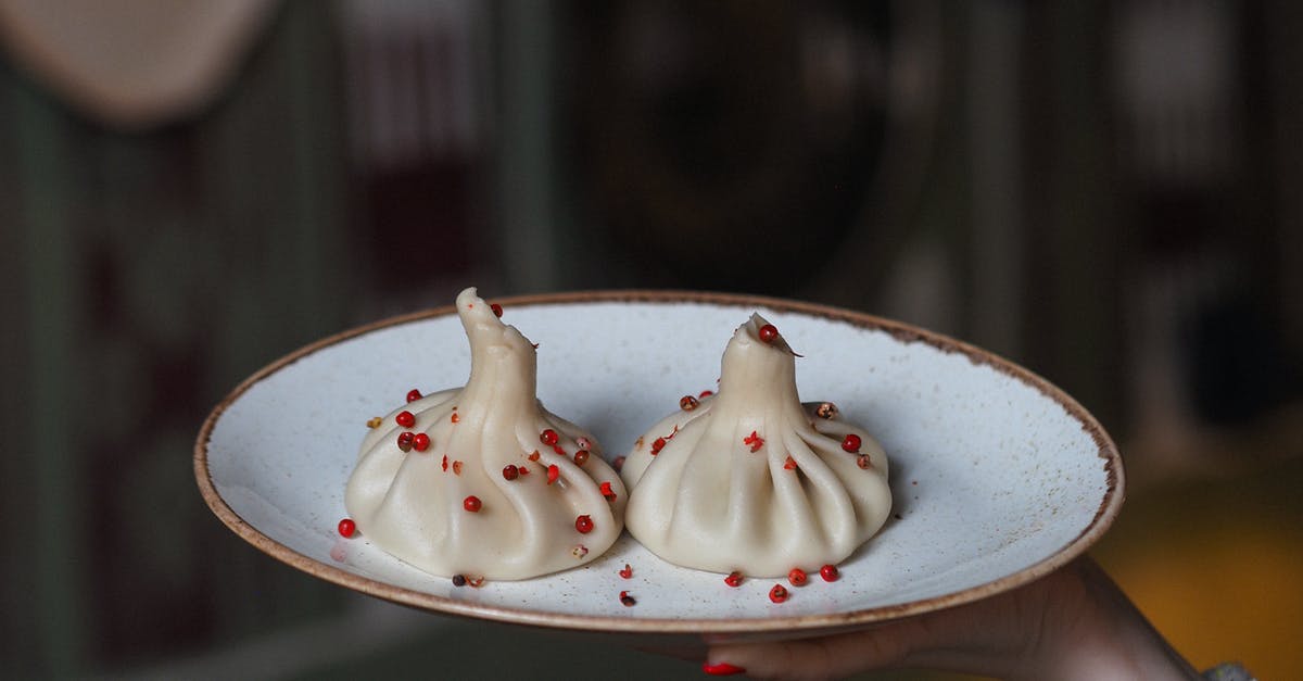 Georgian dumplings (khinkali) sticking to the bottom of the pot - Close-up of a Plate of Khinkali