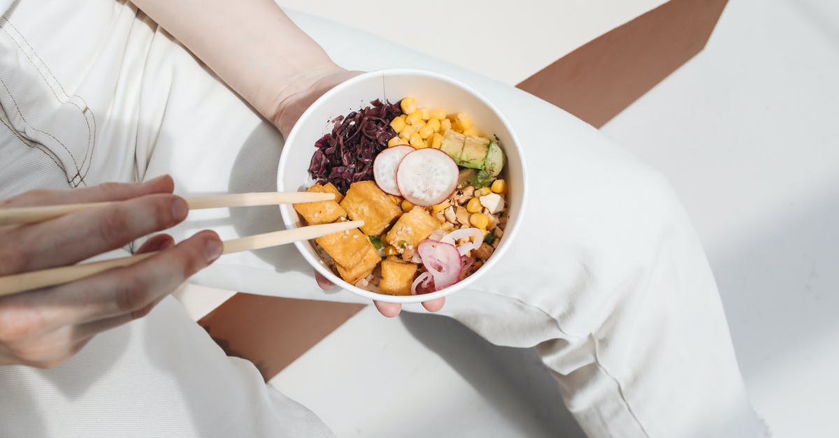 Getting better in the kitchen [duplicate] - Photo of a Person Holding a Poke Bowl