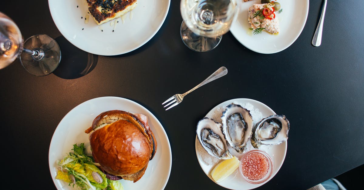 Getting poppy seeds to stick to bagel - Plates with burger and pie neat crackers and mussels