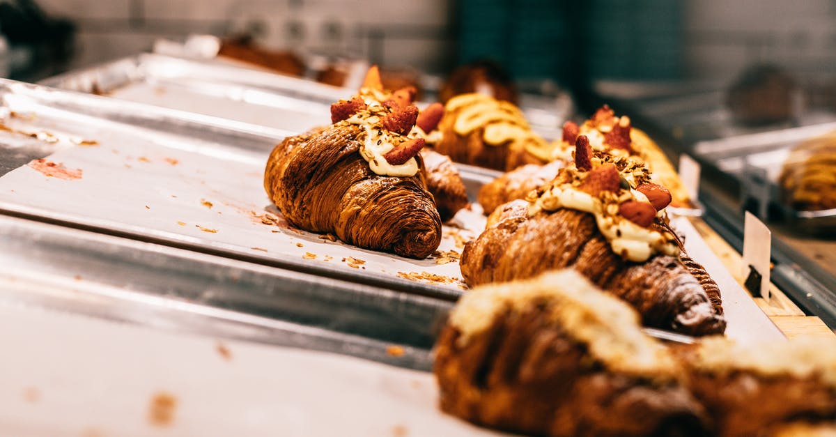 Getting some crispiness in Burgers' crust - Delicious baked croissants on trays