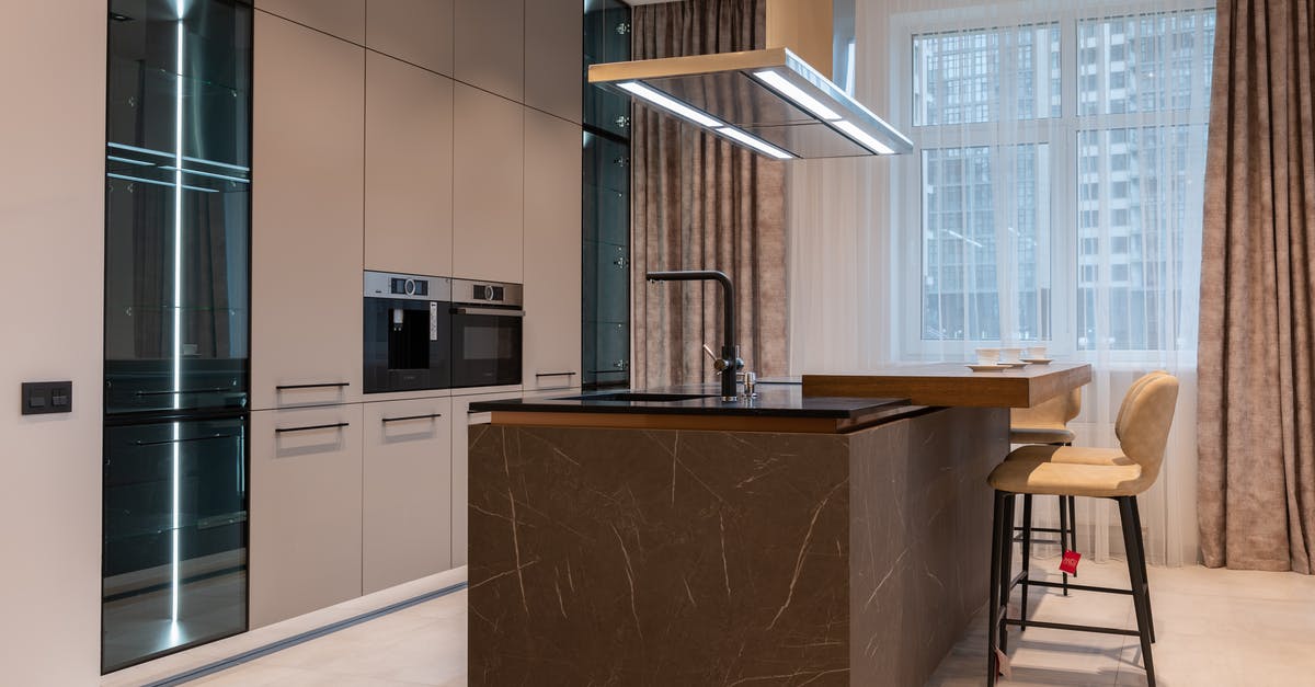 Getting veggies to go soft in the oven - Interior of modern kitchen with furniture in daytime