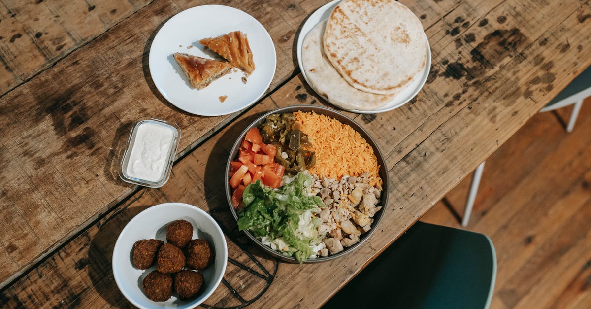 Ghee vs. butter in Indian curries - Various traditional Indian dishes served on table in restaurant