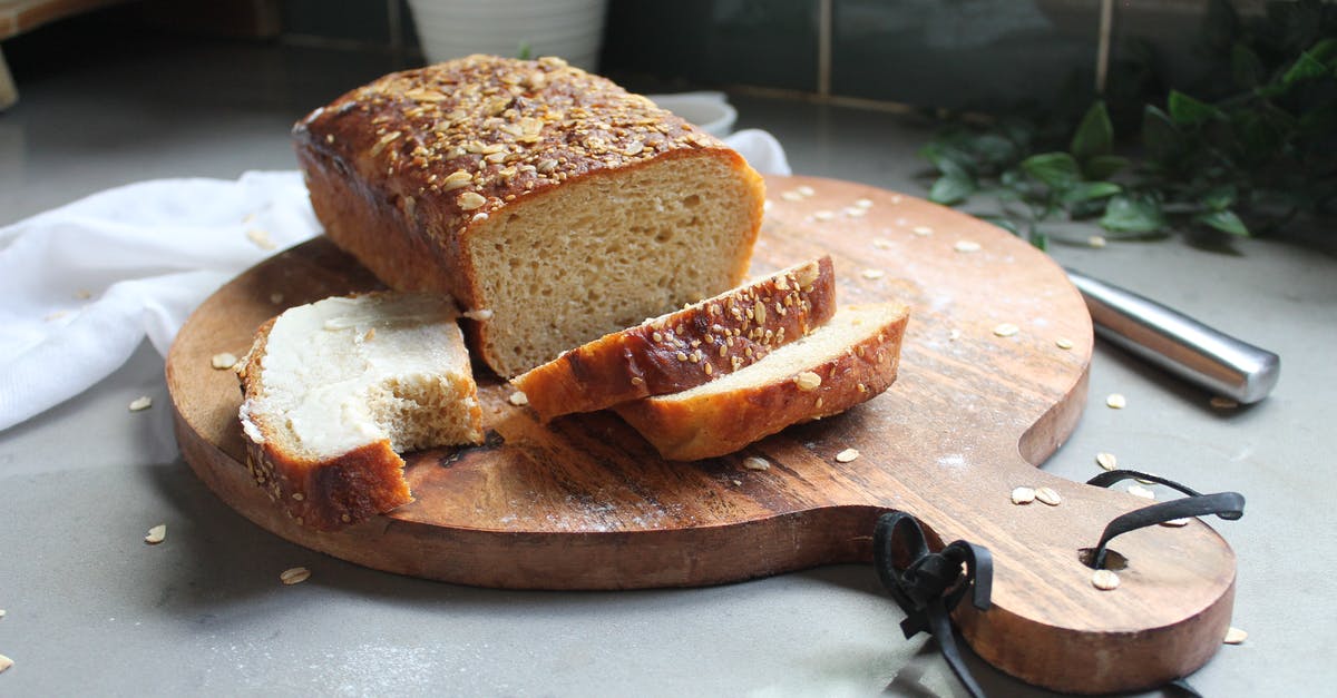 Glazing bread pre-baking - Bread on Brown Wooden Chopping Board