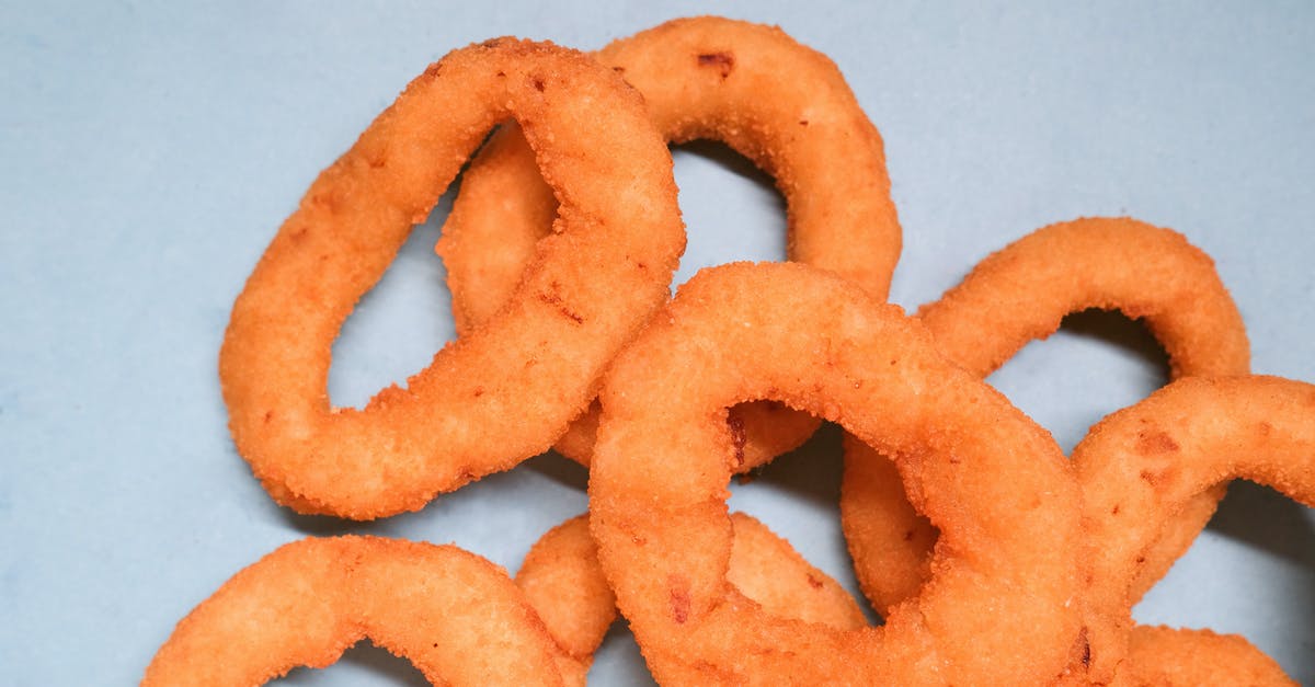 Gluten tester; simple and fast - Deep fried onion rings on blue background