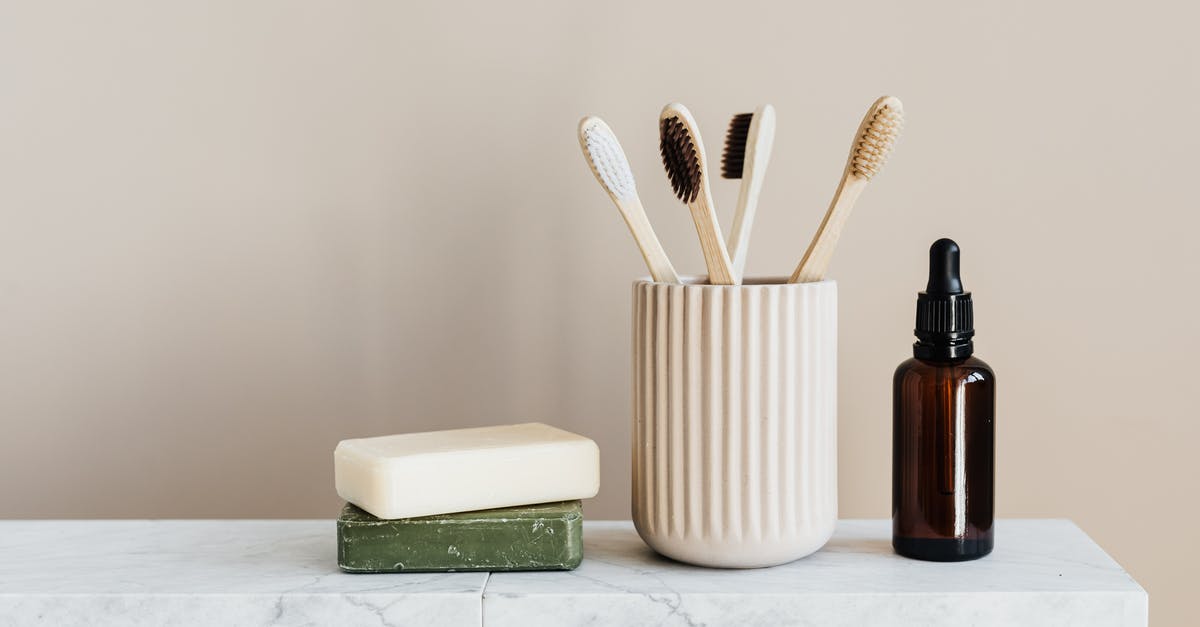 Gluten-free alternatives to beurre manie/roux for thickening sauce? - Collection of organic soaps and bamboo toothbrushes in ceramic minimalism style holder placed near renewable glass bottle with essential oil on white marble tabletop against beige wall