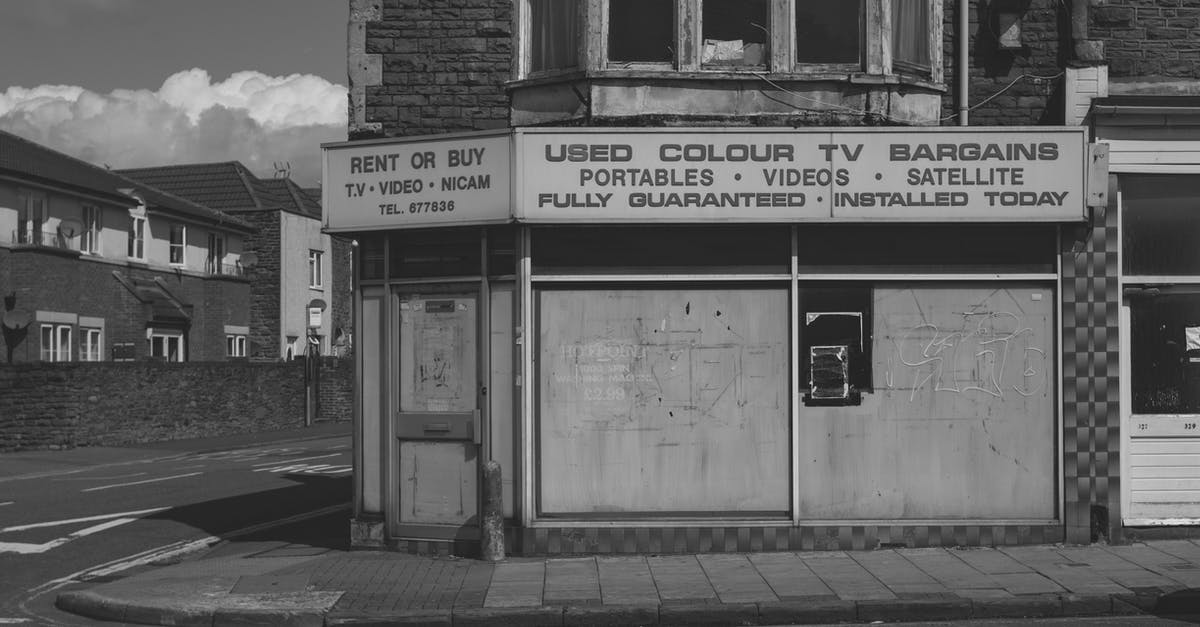 Good video on separating eggs - Black and white of old abandoned building with vintage shop of used electronic goods on empty street of city