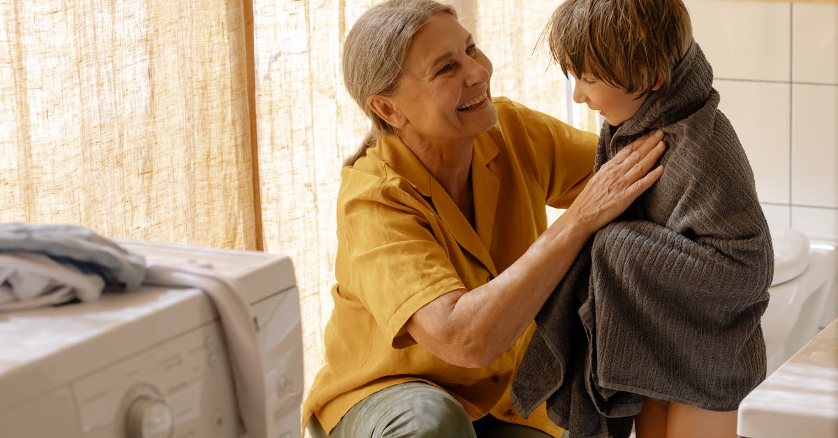 Graphene oxide drying - A Grandmother Drying His Grandson with Towel 