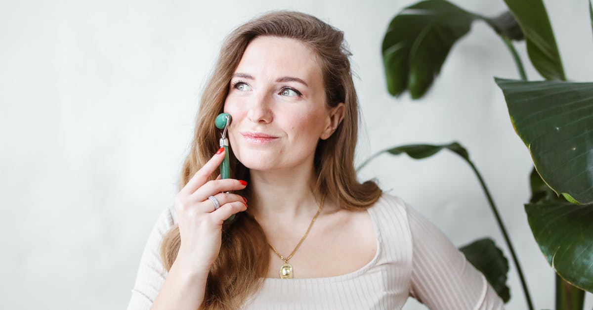 Guidance about using pith in marmalade - Woman in Beige Long Sleeve Shirt Holding a Jade Roller