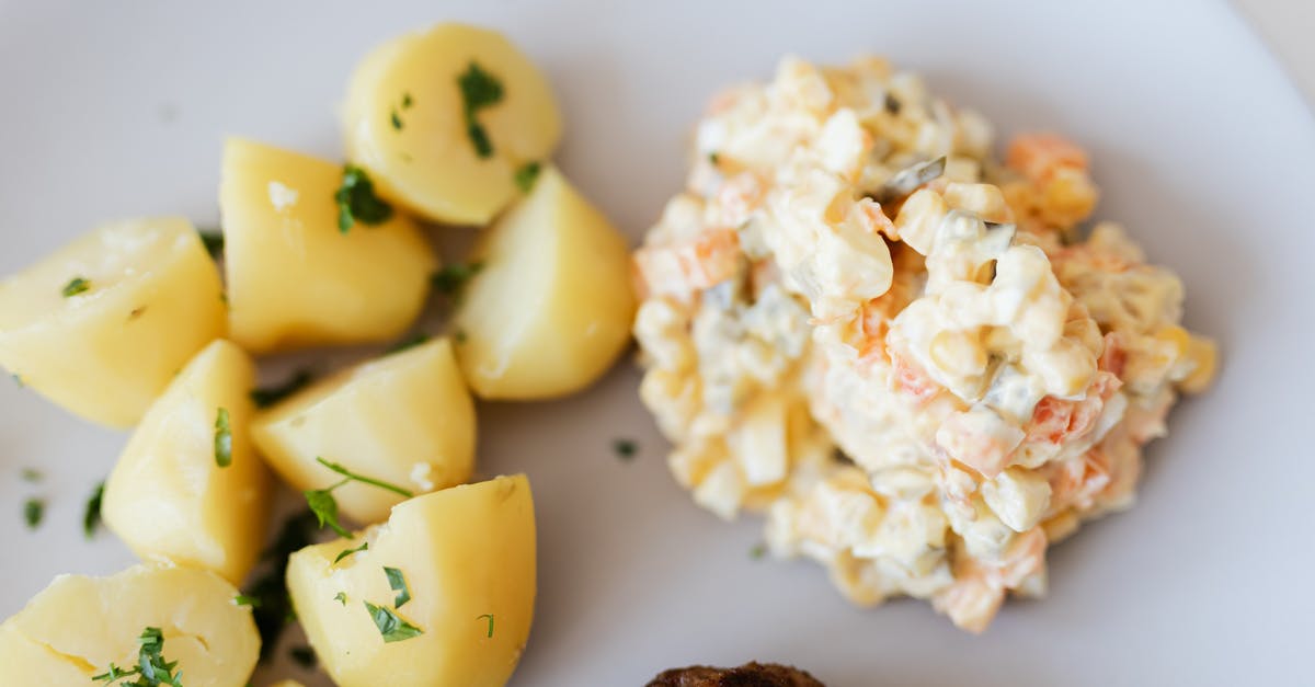 Half Boiling and Freezing meat - Boiled potatoes near traditional Russian salad