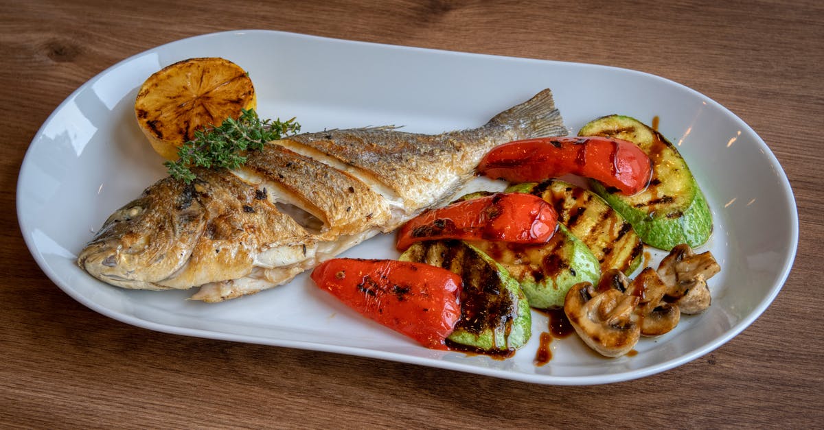 Half cooked fried fish - Fried Fish and Grilled Vegetables