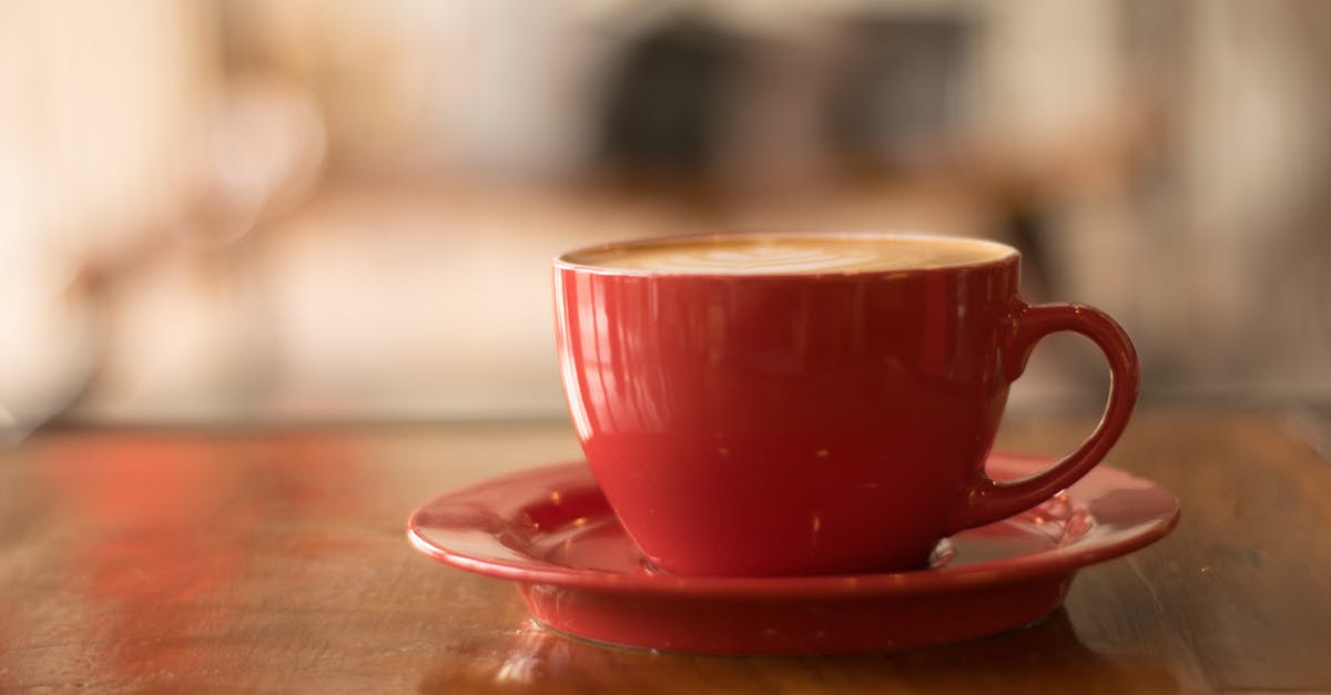 half-life of caffeine molecules - Red Ceramic Mug on Red Saucer