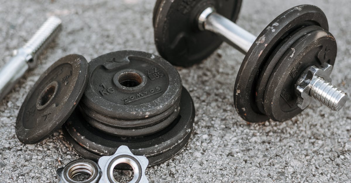 Hard boiled eggs outside the fridge - Metal dumbbell with additional details on ground