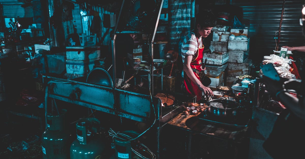 hardened residue after high heat cooking (carbon steel and cast iron) - Man Cooking Near Pots