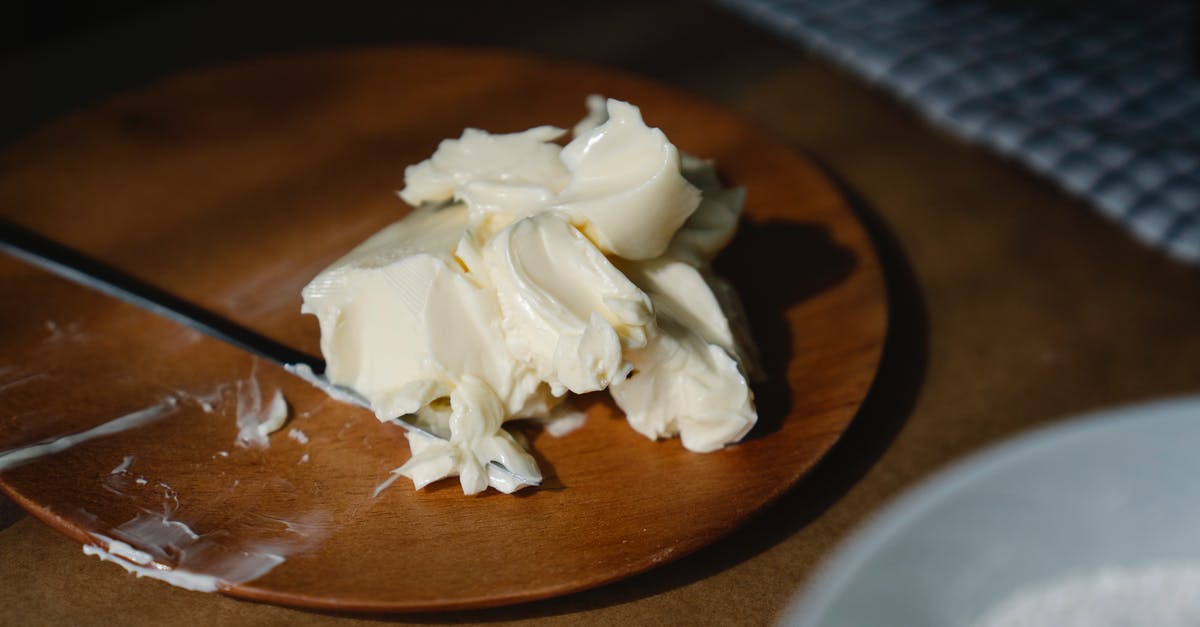 Has anyone ever made margarine out of butter? [closed] - Close-Up Shot of a Creamy Butter on a Wooden Plate