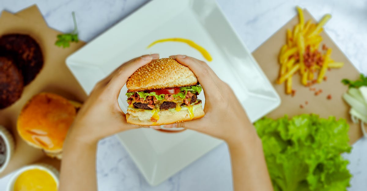 Having trouble with the sweet & sour sauce recipe - Faceless person preparing hamburger in bright cafe