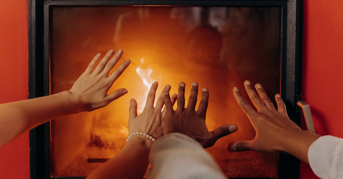 Heating a premade tlayuda? - Couples Hands By Fireplace