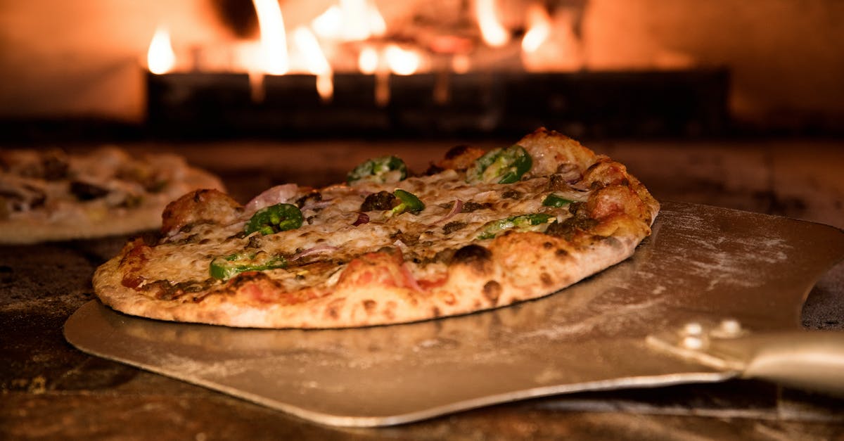 Heating meat in a microwave - Baked Pizza on Pizza Peel in Oven