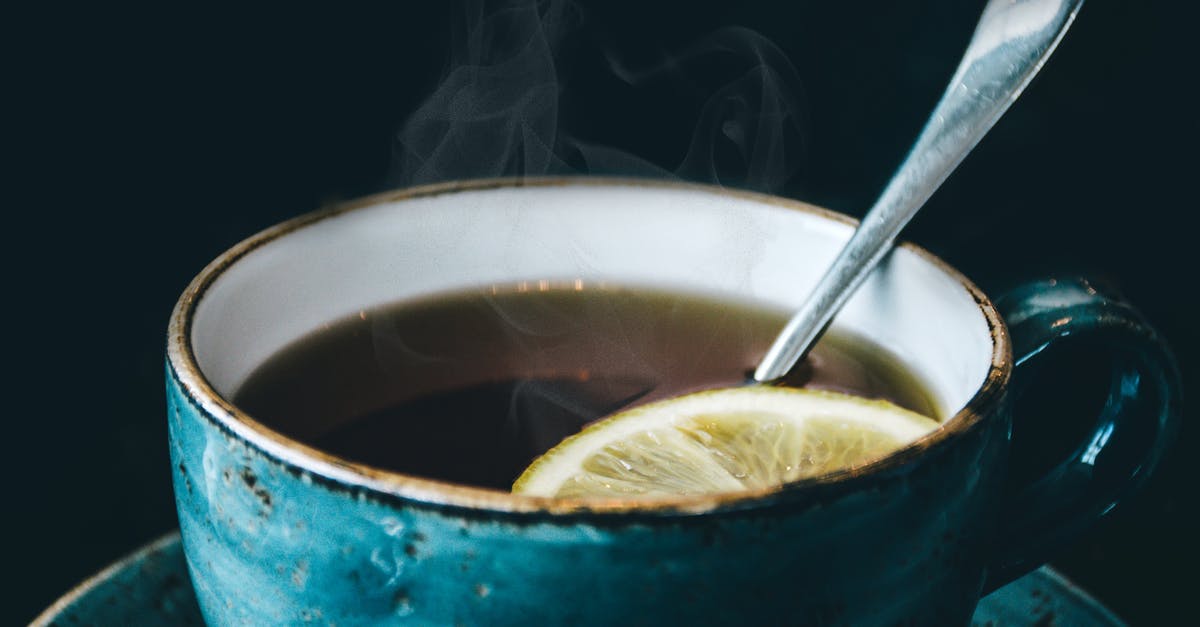 Heating up with steam - Photography of Blue Ceramic Coffee Cup