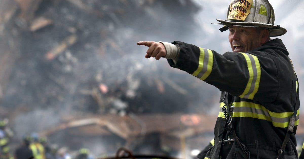 Help me rescue my bland soup - Fire Fighter Wearing Black and Yellow Uniform Pointing for Something