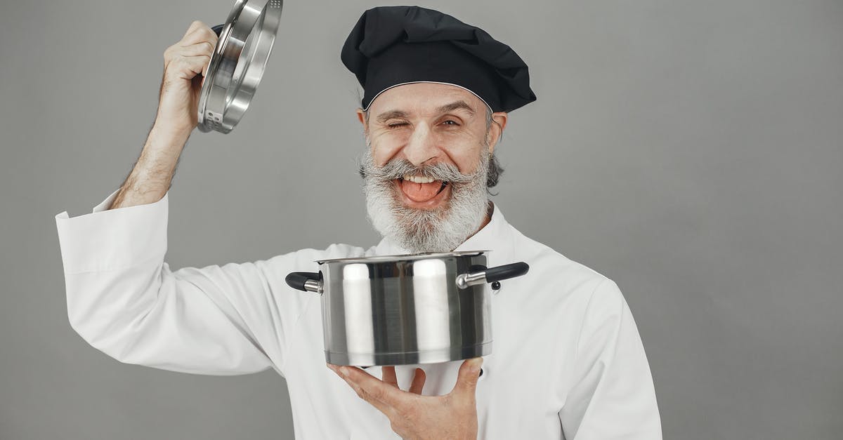 HELP! My Crock-Pot lid was Slightly askew while cooking my roast! - Man in White Chef Suit Holding Stainless Steel Cup