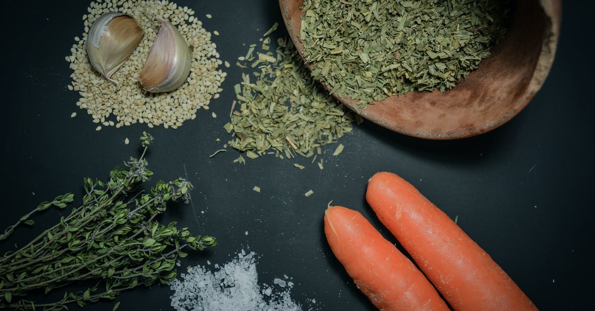 Herbs in Dressing - Fresh vs Dried [duplicate] - Shallow Focus Photography of Two Orange Carrots