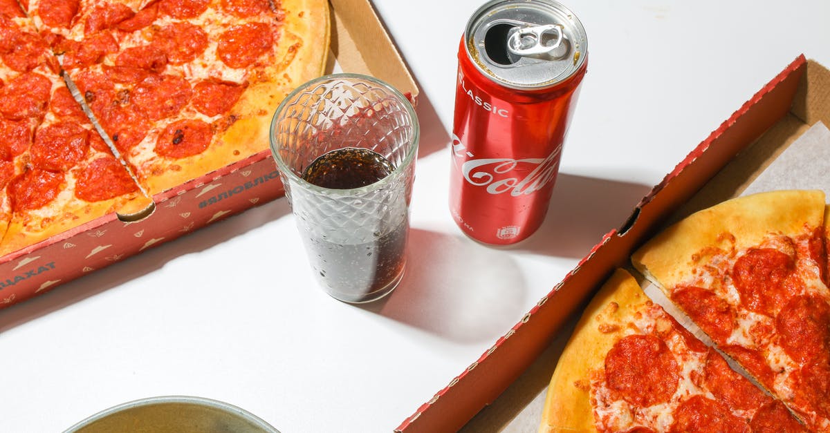 High altitude pizza crust - how to adjust yeast? - Coca Cola Can Beside Pizza on White Table