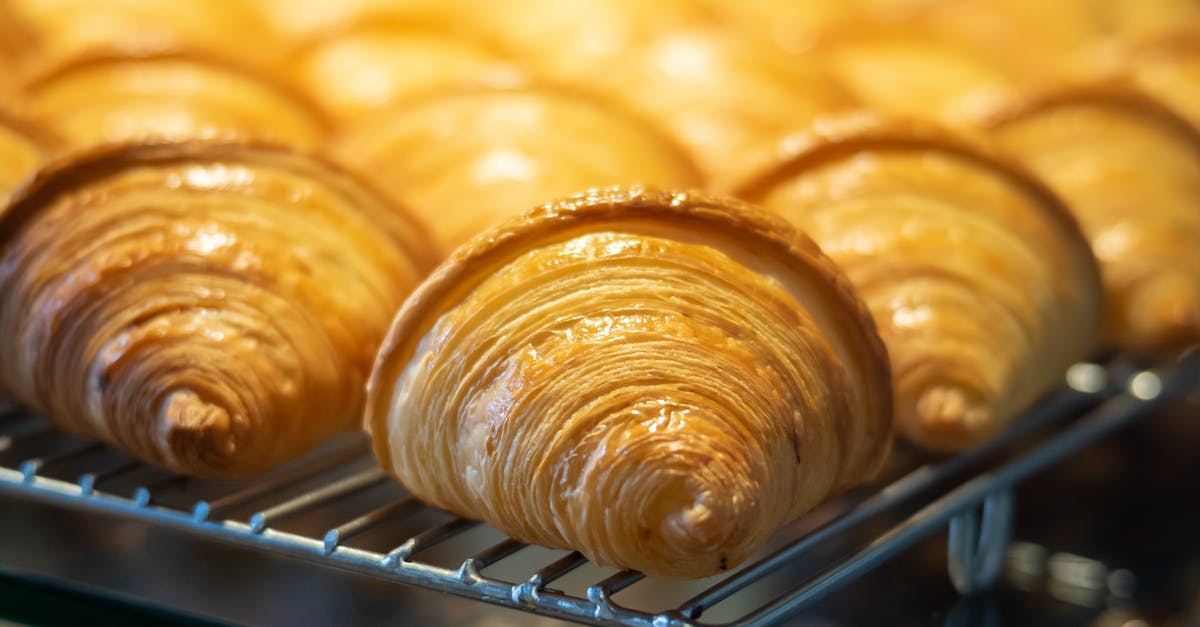 Higher temp and lower rack for thicker crust in brownies? - Delicious croissants on rack in pastry shop