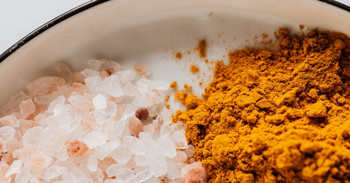 Himalayan salt in a brine - Assorted spices in white metal bowl