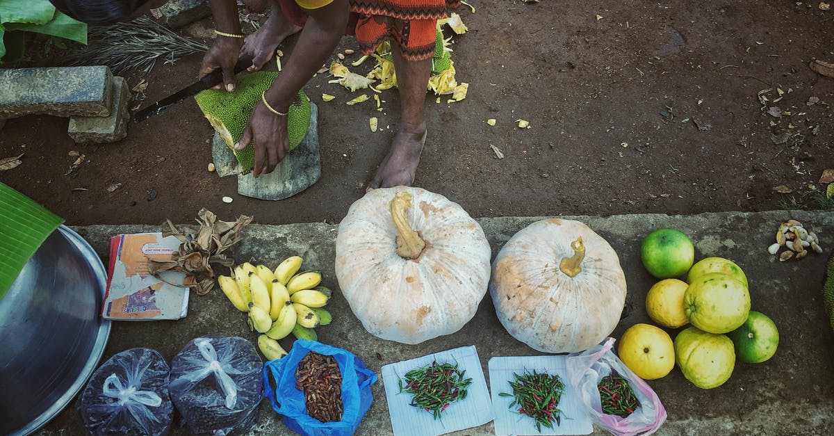 Hints on storage of vegetables and fruit - Woman with Stacked Fruit and Vegetables