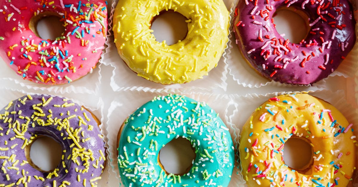 Holes in baked cake - Pink Doughnut on White Textile