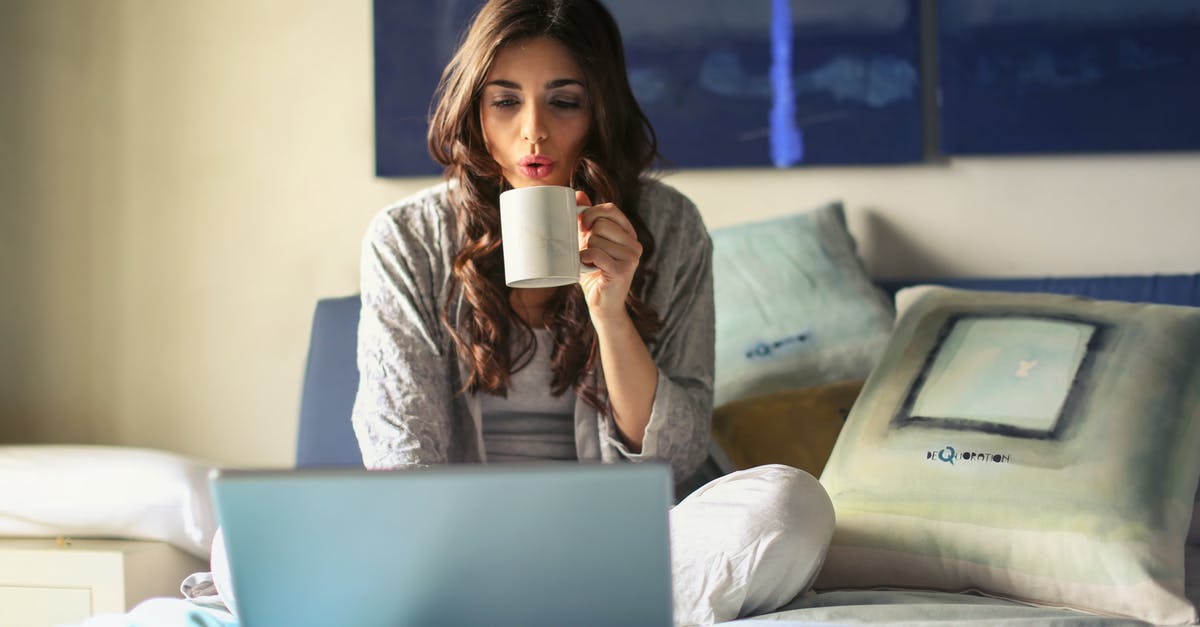 Home canning coffee? - Woman in Grey Jacket Sits on Bed Uses Grey Laptop