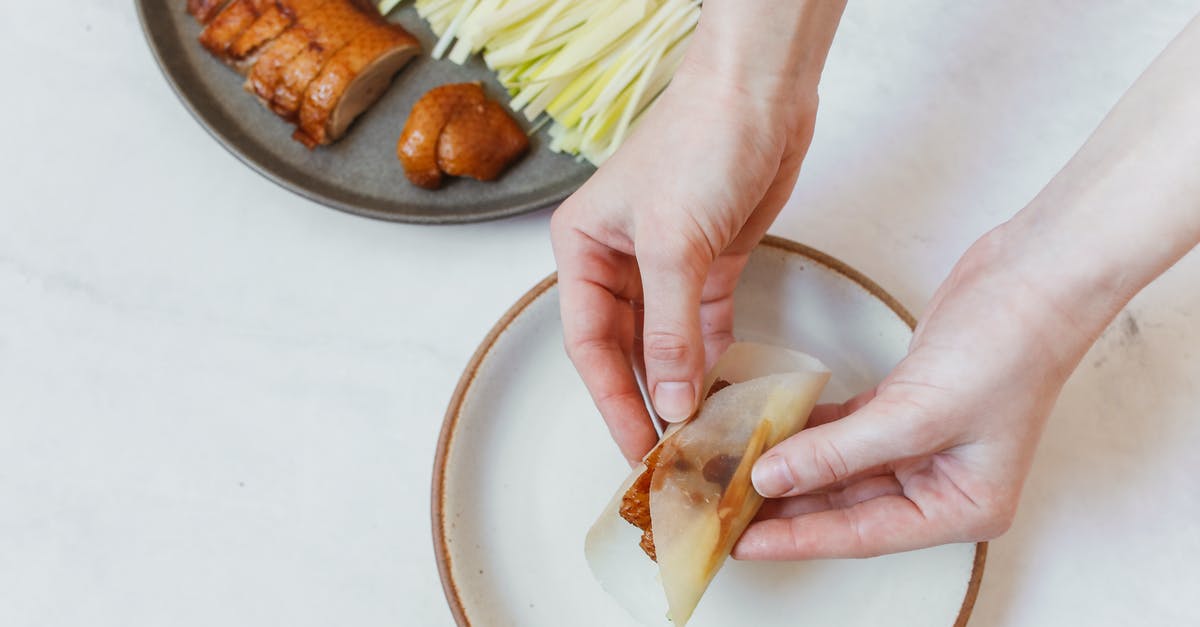 Homemade Crunchy Chinese Chicken - Person Holding Sliced of Bread