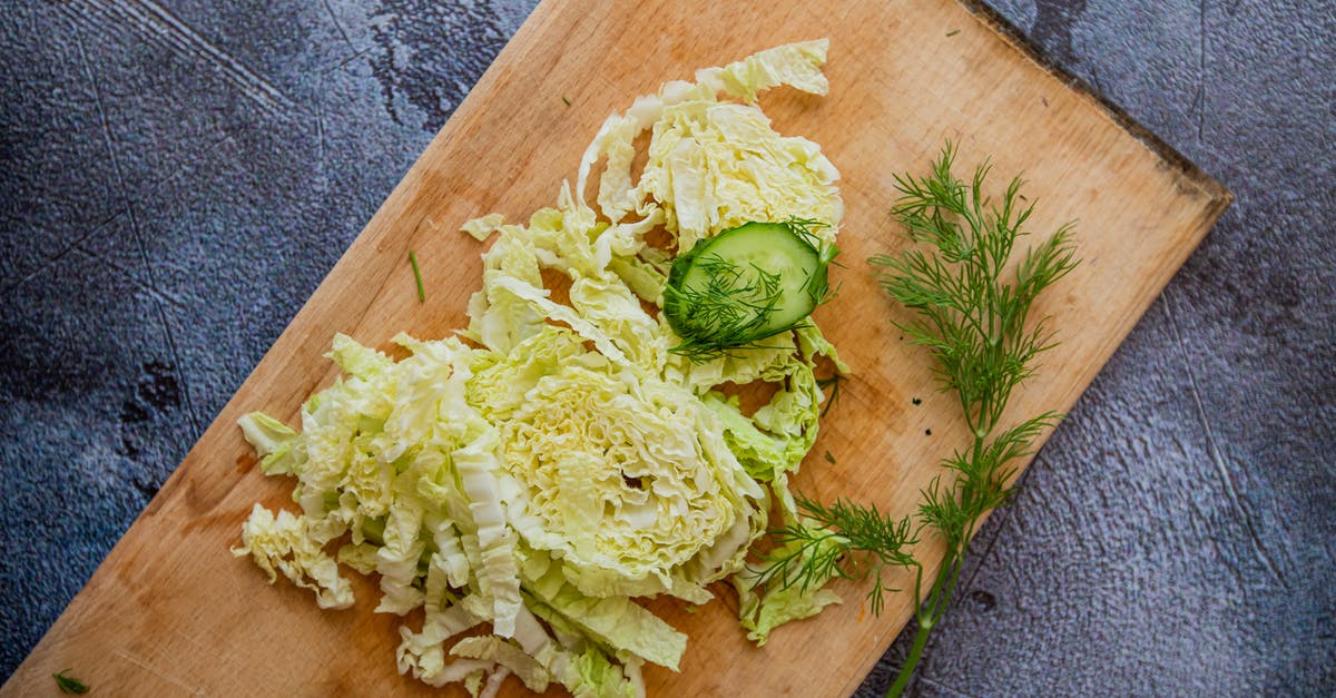 Homemade Dill for Charity [closed] - Chopped cabbage on cutting board with herbs and cucumber slice