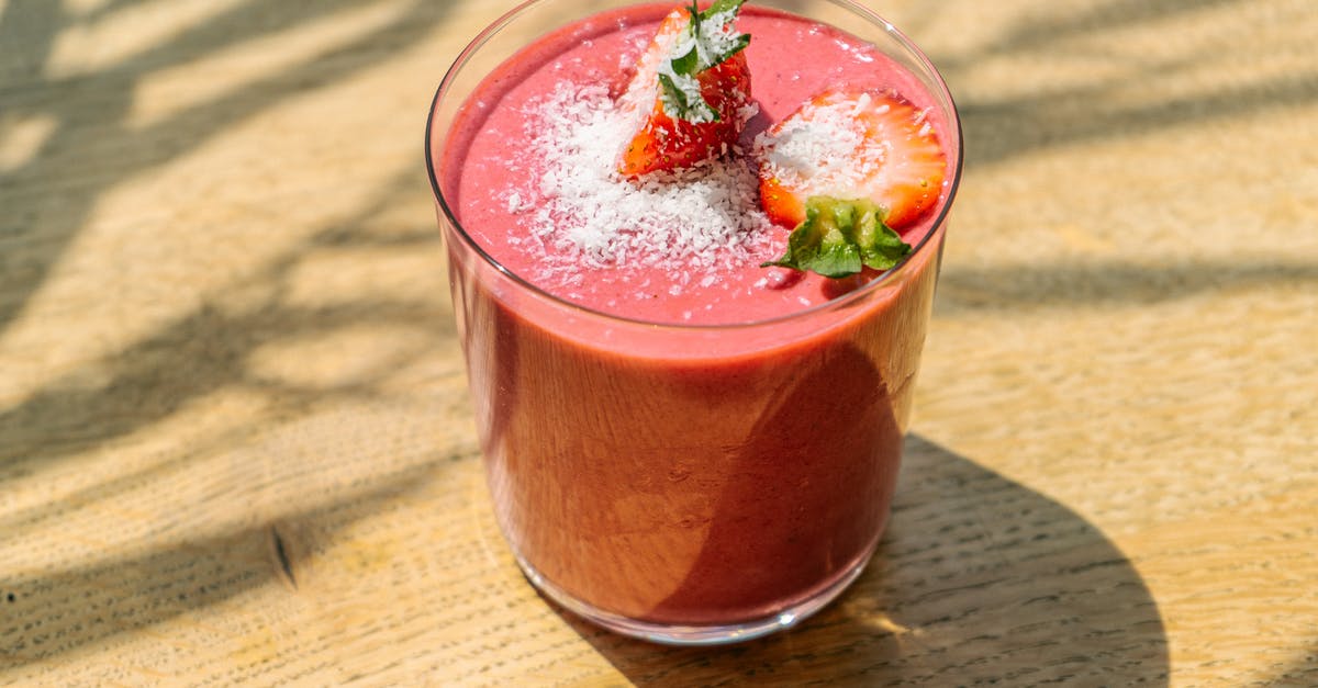 Homemade sport drink [closed] - Clear Drinking Glass With Red Liquid on Brown Wooden Table