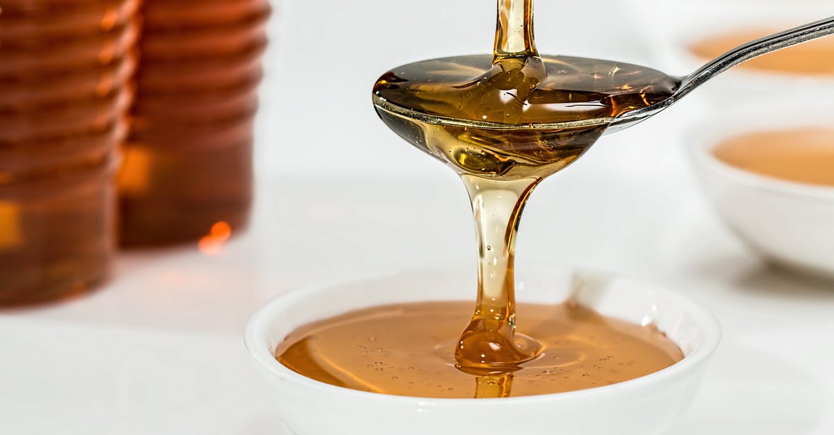 Honey changing into unusable, hardened clump - Honey on White Bowl