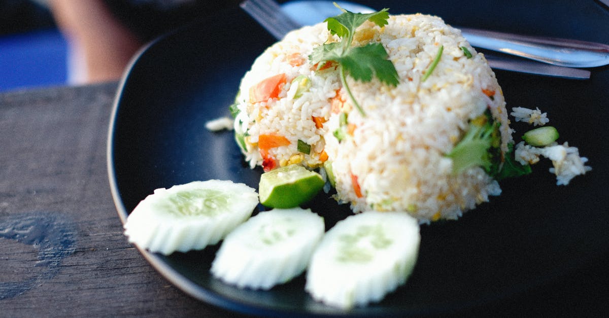 How are puffed rice cakes flavoured? - White Rice With Green Leaf Vegetable on Blue Ceramic Plate