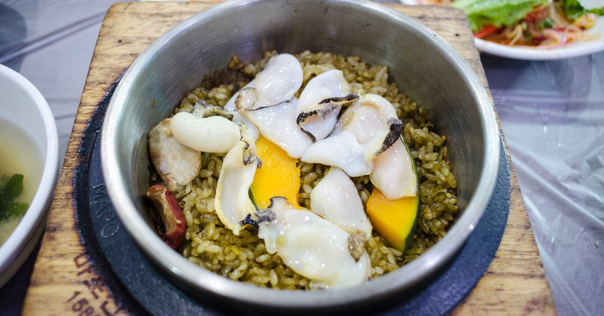 How are puffed rice cakes flavoured? - Close-up of Abalone Rice Hot Pot